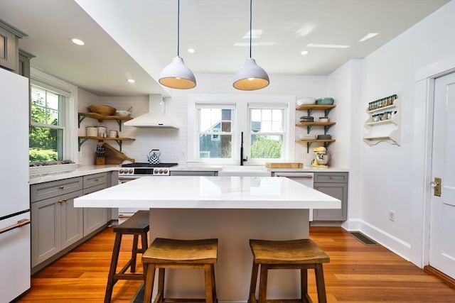 15 N Pleasant, Dartmouth, MA 02748 - kitchen featuring gray cabinets, open shelves, custom range hood, freestanding refrigerator, and recessed lighting