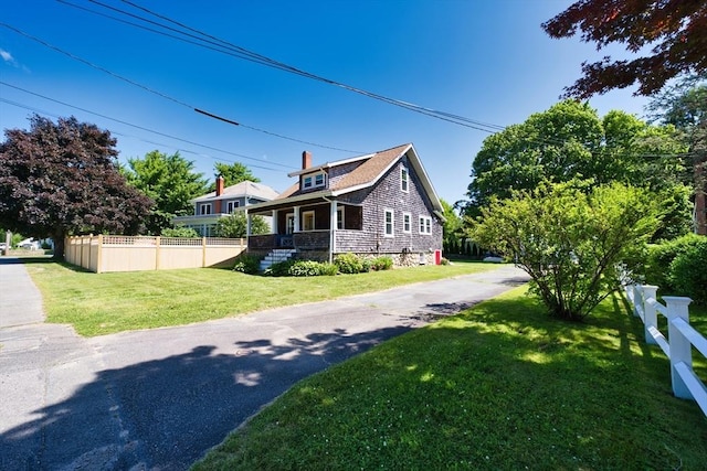 15 N Pleasant, Dartmouth, MA 02748 - view of property exterior with a chimney and a porch