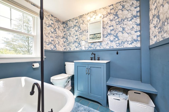 15 N Pleasant, Dartmouth, MA 02748 - bathroom featuring a wainscoted wall, wallpapered walls, a freestanding tub, vanity, and tile patterned floors