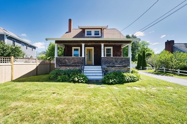 15 N Pleasant, Dartmouth, MA 02748 - view of front of property with a chimney, a porch, and roof with shingles