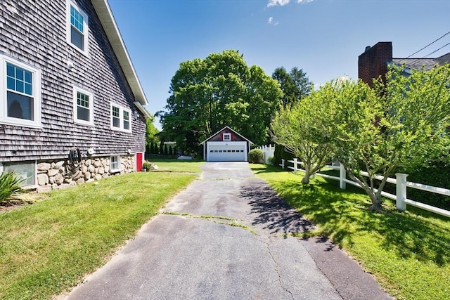 15 N Pleasant, Dartmouth, MA 02748 - view of side of property with a garage, an outbuilding, and a yard