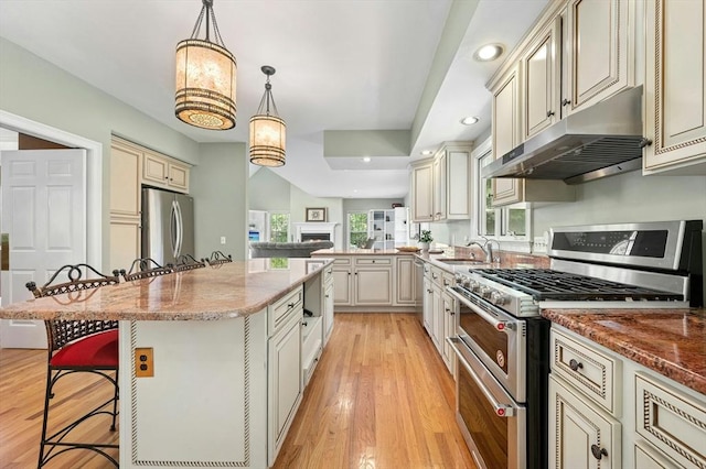 15 Keyes House Rd, Shrewsbury, MA 01545 - kitchen with appliances with stainless steel finishes, under cabinet range hood, cream cabinets, and recessed lighting