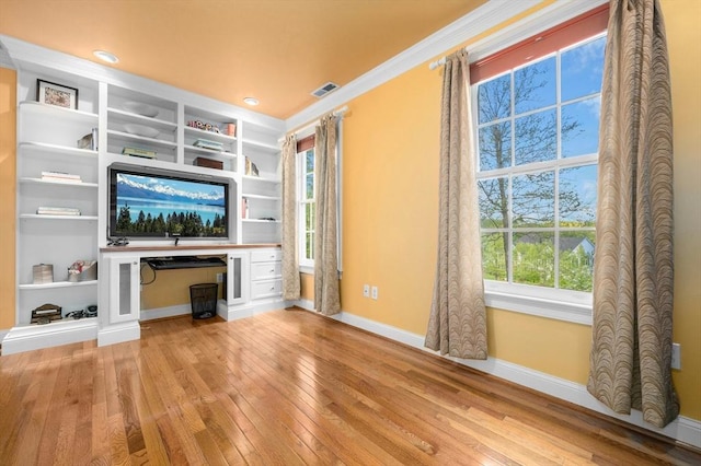 15 Keyes House Rd, Shrewsbury, MA 01545 - unfurnished living room featuring baseboards, light wood-style floors, healthy amount of natural light, crown molding, and built in features