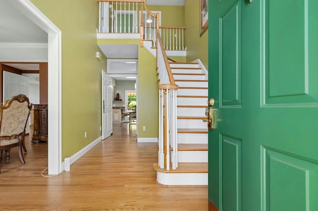 15 Keyes House Rd, Shrewsbury, MA 01545 - foyer with stairs, light wood-style flooring, baseboards, and ornamental molding