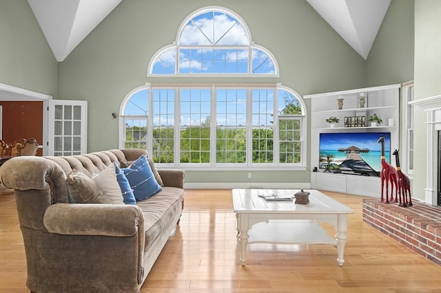 15 Keyes House Rd, Shrewsbury, MA 01545 - living room with high vaulted ceiling, plenty of natural light, and wood finished floors