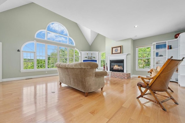 15 Keyes House Rd, Shrewsbury, MA 01545 - living area featuring light wood-type flooring, high vaulted ceiling, a fireplace, baseboards, and recessed lighting