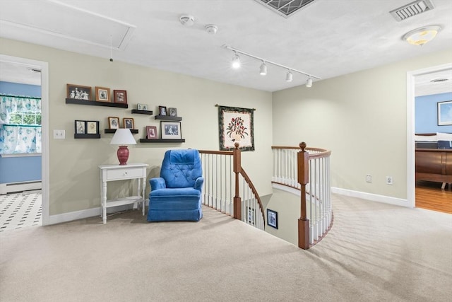 1 Burnham Ln, Danvers, MA 01923 - sitting room with attic access, a baseboard radiator, an upstairs landing, carpet floors, and rail lighting