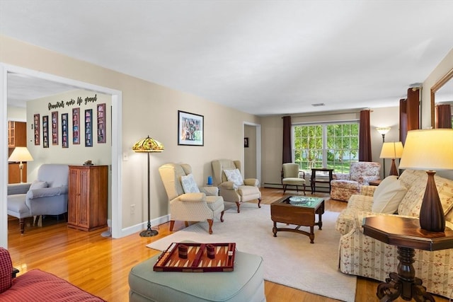 1 Burnham Ln, Danvers, MA 01923 - living area featuring light wood-style flooring and baseboard heating