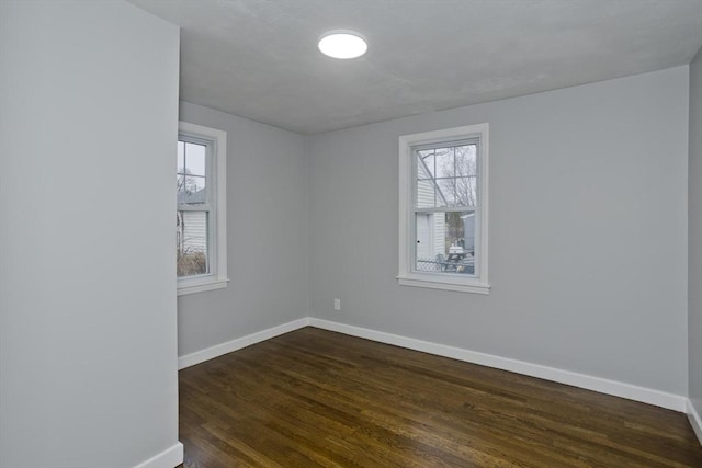 empty room featuring dark hardwood / wood-style floors