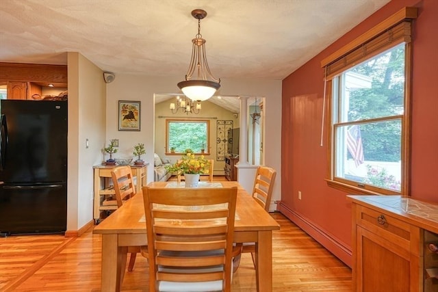113 Edgehill Rd Unit 113, Norwood, MA 02062 - dining space with baseboard heating, light wood-style floors, and a chandelier