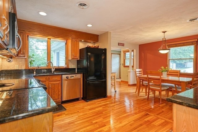 113 Edgehill Rd Unit 113, Norwood, MA 02062 - kitchen with appliances with stainless steel finishes, healthy amount of natural light, dark countertops, decorative backsplash, and recessed lighting