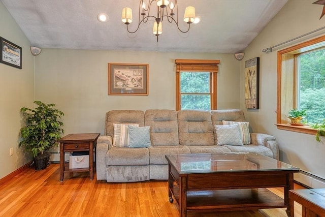 113 Edgehill Rd Unit 113, Norwood, MA 02062 - living area with a chandelier, light wood-style floors, lofted ceiling, recessed lighting, and baseboard heating