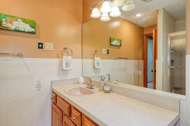 113 Edgehill Rd Unit 113, Norwood, MA 02062 - bathroom with vanity, a stall shower, tile walls, a chandelier, and wainscoting