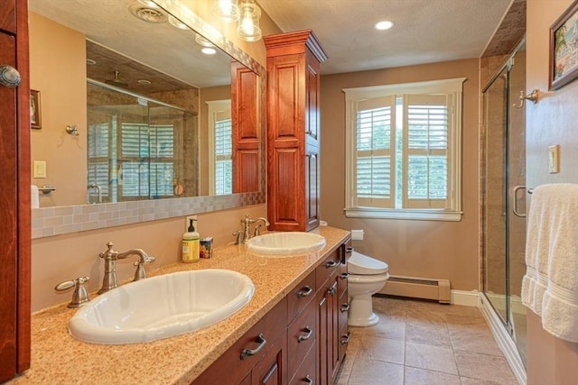 113 Edgehill Rd Unit 113, Norwood, MA 02062 - bathroom with a baseboard radiator, a stall shower, double vanity, tile patterned floors, and recessed lighting