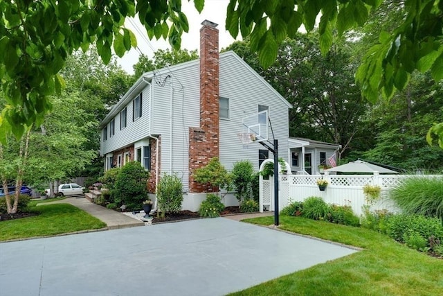 113 Edgehill Rd Unit 113, Norwood, MA 02062 - view of property exterior featuring a chimney