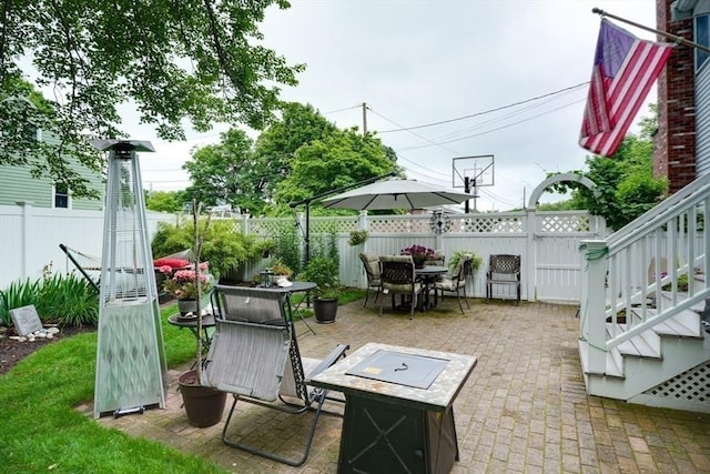 113 Edgehill Rd Unit 113, Norwood, MA 02062 - fenced backyard with outdoor dining area, a patio, and a fire pit