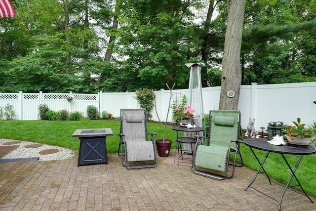 113 Edgehill Rd Unit 113, Norwood, MA 02062 - fenced backyard with a patio and an outdoor fire pit
