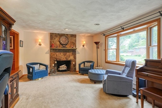 113 Edgehill Rd Unit 113, Norwood, MA 02062 - living area featuring a textured ceiling, carpet, and a fireplace