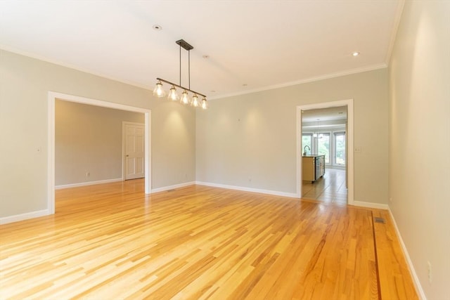 109 Wild Grove Ln, Longmeadow, MA 01106 - unfurnished room featuring crown molding, light wood-style floors, and baseboards