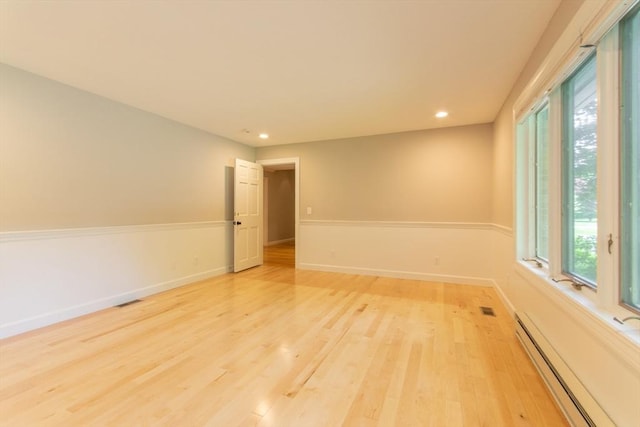 109 Wild Grove Ln, Longmeadow, MA 01106 - spare room with baseboard heating, light wood-style floors, recessed lighting, and baseboards