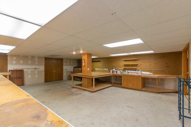 109 Wild Grove Ln, Longmeadow, MA 01106 - kitchen with concrete floors, a paneled ceiling, and brown cabinets