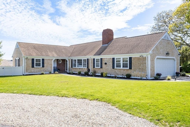 view of front facade featuring a chimney, an attached garage, roof with shingles, and driveway