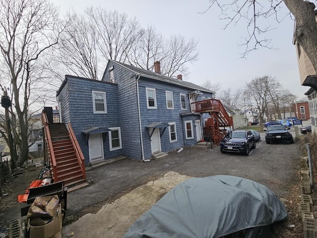 21 John, Worcester, MA 01609 - exterior space featuring a chimney, entry steps, and stairs