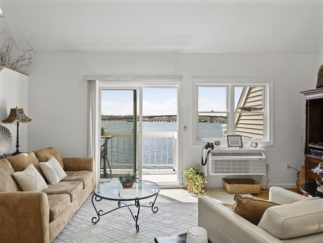 living room with a water view and plenty of natural light