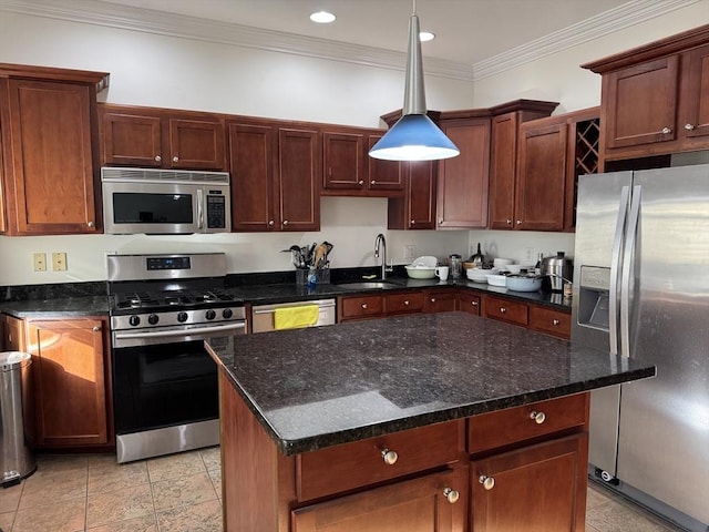 kitchen with pendant lighting, crown molding, sink, dark stone countertops, and appliances with stainless steel finishes