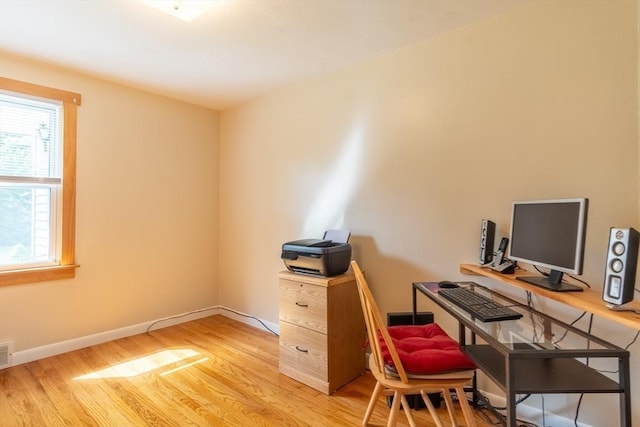 office with light wood finished floors and baseboards