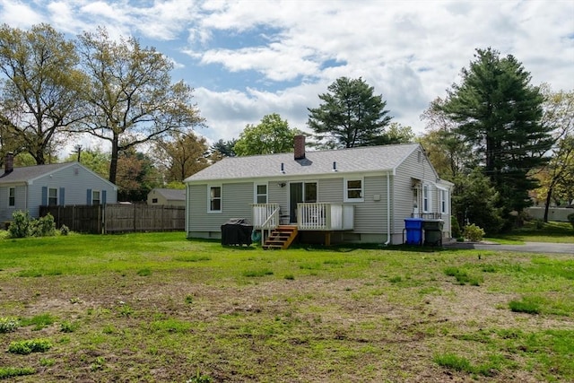 back of property with a chimney