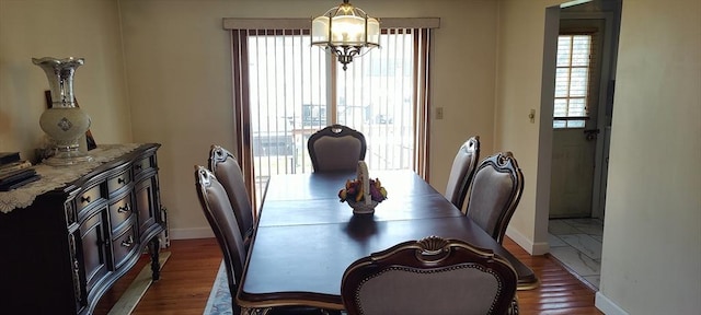 107 Chestnut Cir, Randolph, MA 02368 - dining space featuring dark wood finished floors, baseboards, and a chandelier