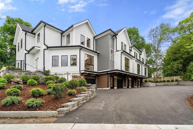 2202 Commonwealth Ave Unit 3, Newton, MA 02466 - view of front of property with a garage and asphalt driveway