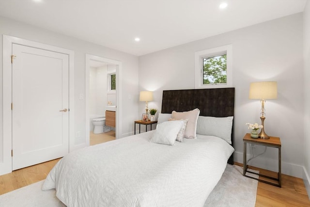 2202 Commonwealth Ave Unit 3, Newton, MA 02466 - bedroom with light wood-style floors, ensuite bath, and recessed lighting