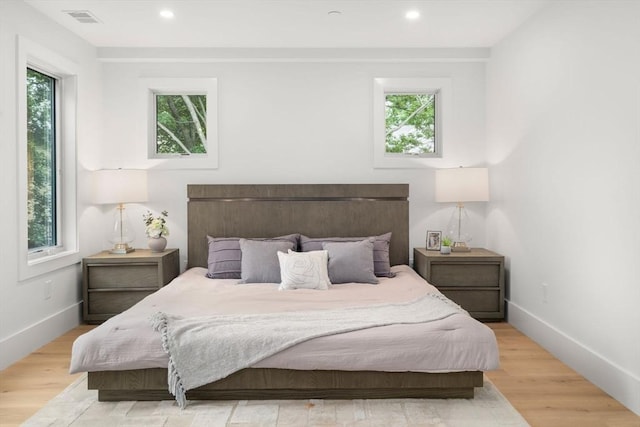 2202 Commonwealth Ave Unit 3, Newton, MA 02466 - bedroom featuring multiple windows, wood finished floors, and recessed lighting