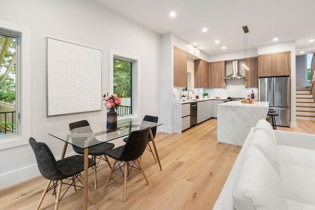 2202 Commonwealth Ave Unit 3, Newton, MA 02466 - dining area featuring light wood-style floors, stairway, and recessed lighting