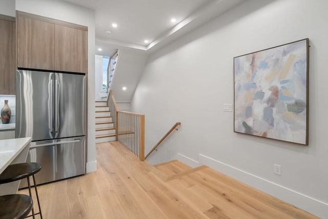 2202 Commonwealth Ave Unit 3, Newton, MA 02466 - kitchen with stainless steel fridge, modern cabinets, light wood finished floors, light countertops, and recessed lighting