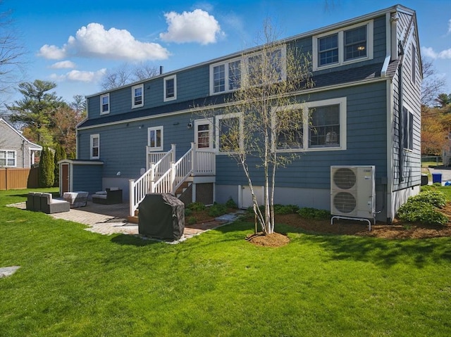back of property with a lawn, a patio, ac unit, and an outdoor hangout area