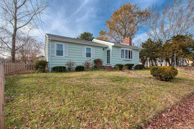 ranch-style home with a front yard