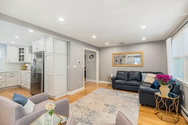 31 Orchard Rd, Hamilton, MA 01982 - living room featuring recessed lighting, light wood-style floors, and baseboard heating