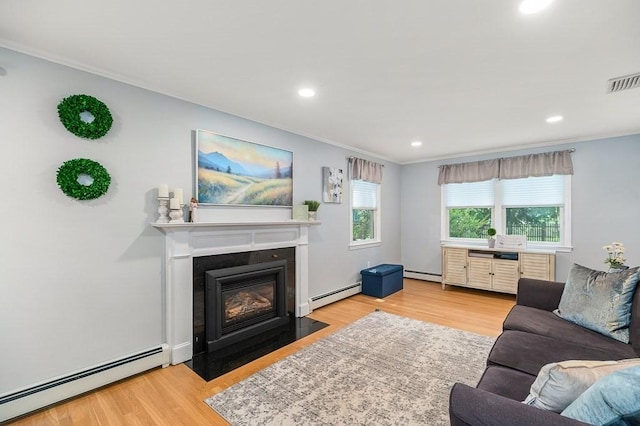 31 Orchard Rd, Hamilton, MA 01982 - living room featuring a baseboard heating unit, wood finished floors, ornamental molding, a fireplace with flush hearth, and recessed lighting