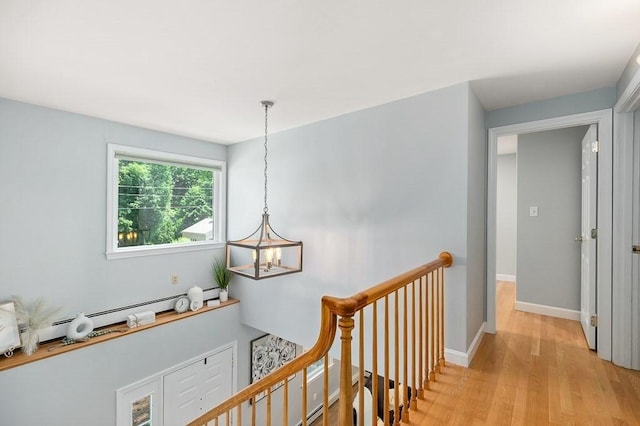 31 Orchard Rd, Hamilton, MA 01982 - hall featuring an upstairs landing, a chandelier, and light wood-type flooring