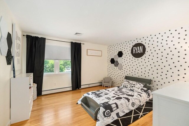 31 Orchard Rd, Hamilton, MA 01982 - bedroom featuring baseboard heating and light wood-style flooring