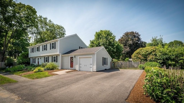 31 Orchard Rd, Hamilton, MA 01982 - colonial inspired home featuring a garage and asphalt driveway