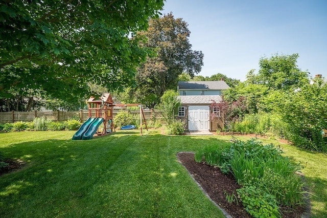 31 Orchard Rd, Hamilton, MA 01982 - view of yard with a playground and an outbuilding