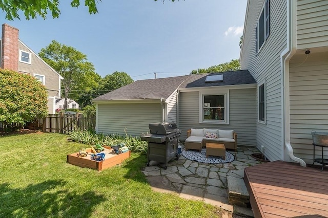 31 Orchard Rd, Hamilton, MA 01982 - rear view of house with an outdoor hangout area, roof with shingles, a patio area, and a garden