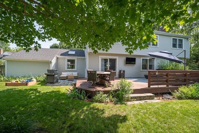 31 Orchard Rd, Hamilton, MA 01982 - back of house with a lawn, a deck, and a garden