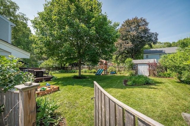 31 Orchard Rd, Hamilton, MA 01982 - fenced backyard with a storage unit and a playground