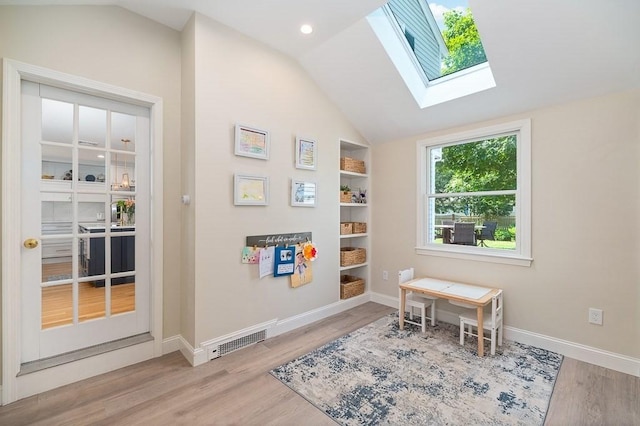 31 Orchard Rd, Hamilton, MA 01982 - sitting room featuring wood finished floors, a skylight, and lofted ceiling