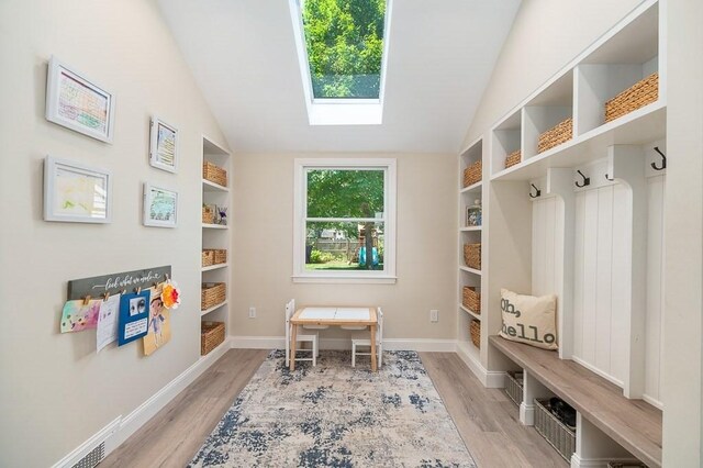 31 Orchard Rd, Hamilton, MA 01982 - mudroom with light wood-style flooring, a skylight, lofted ceiling, and built in features